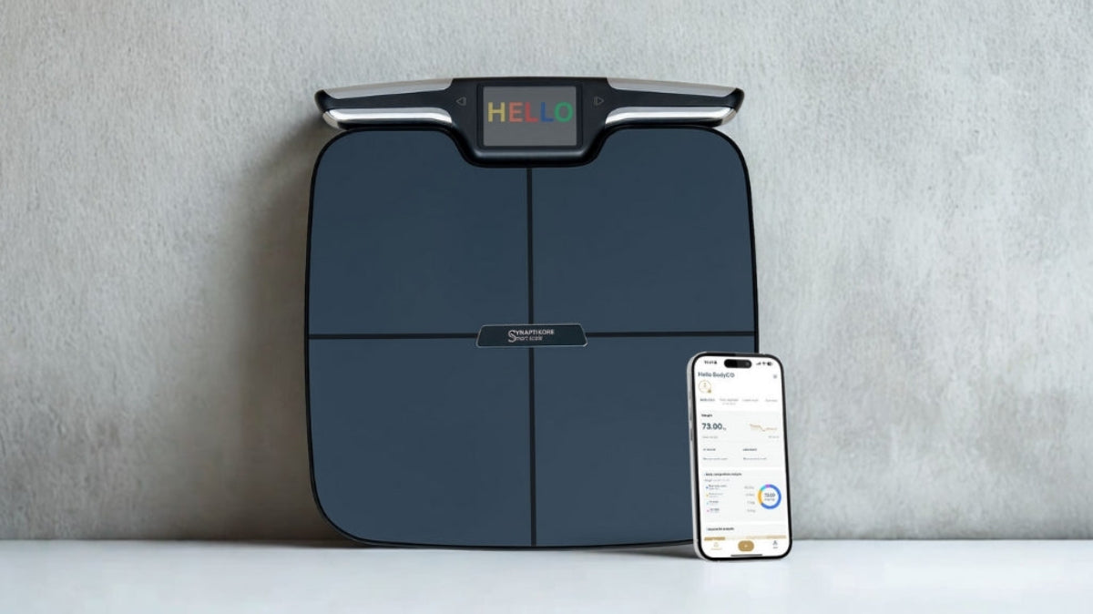 Smart weight scale with smartphone on a gray background